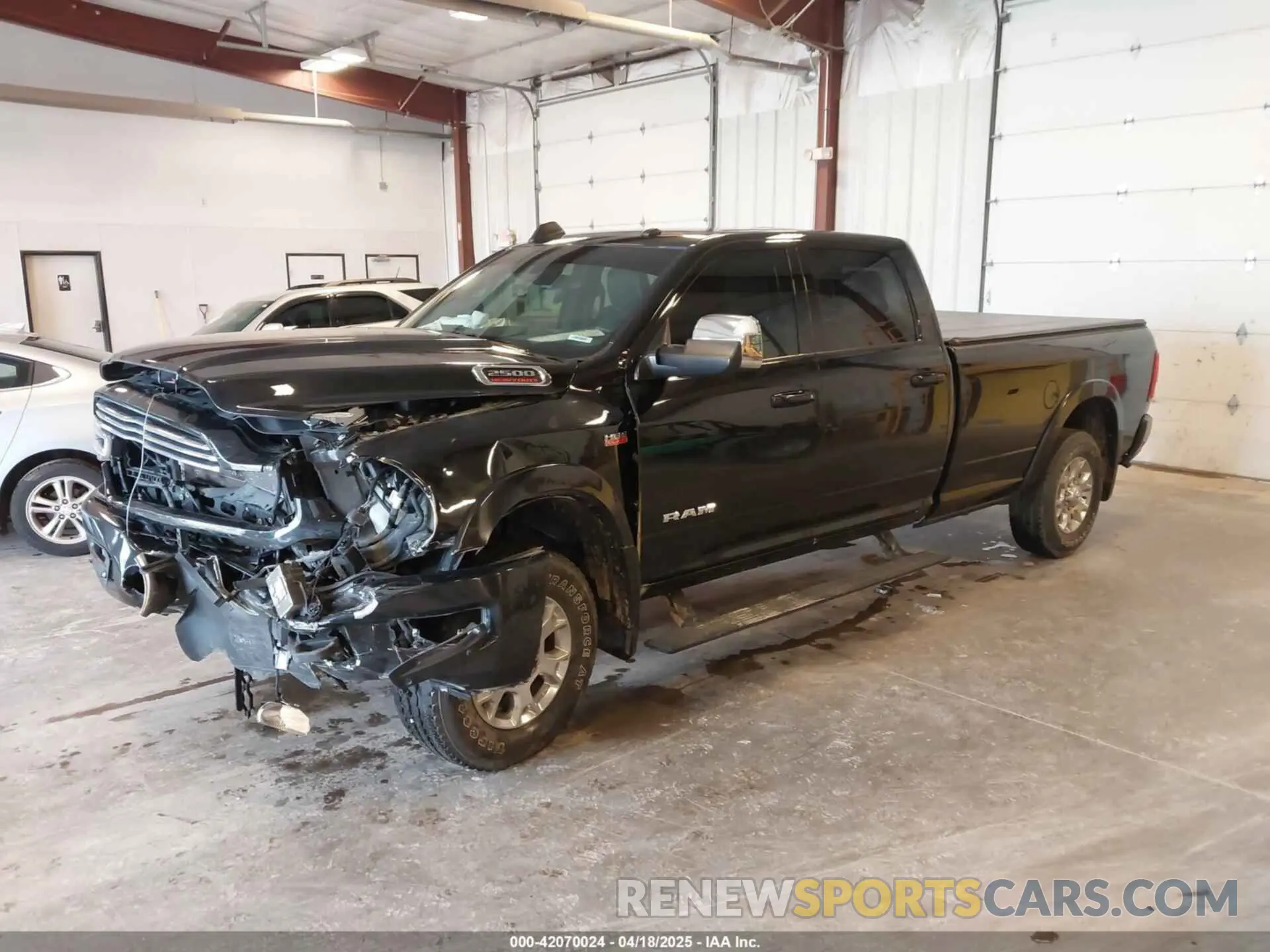 2 Photograph of a damaged car 3C6UR5KJXNG191933 RAM 2500 2022