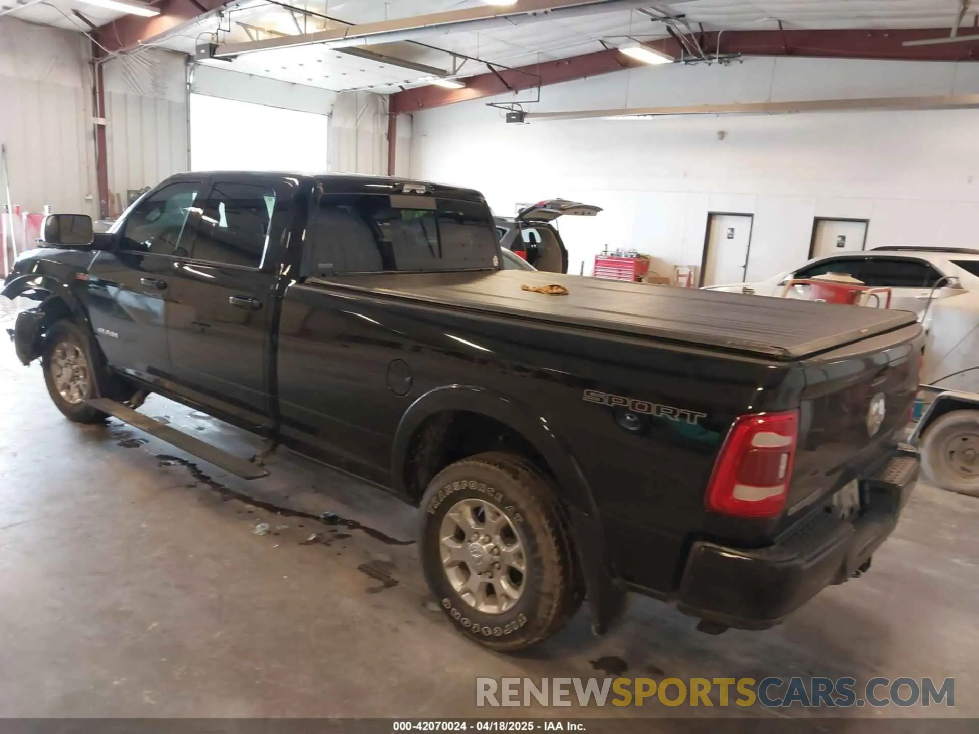 3 Photograph of a damaged car 3C6UR5KJXNG191933 RAM 2500 2022