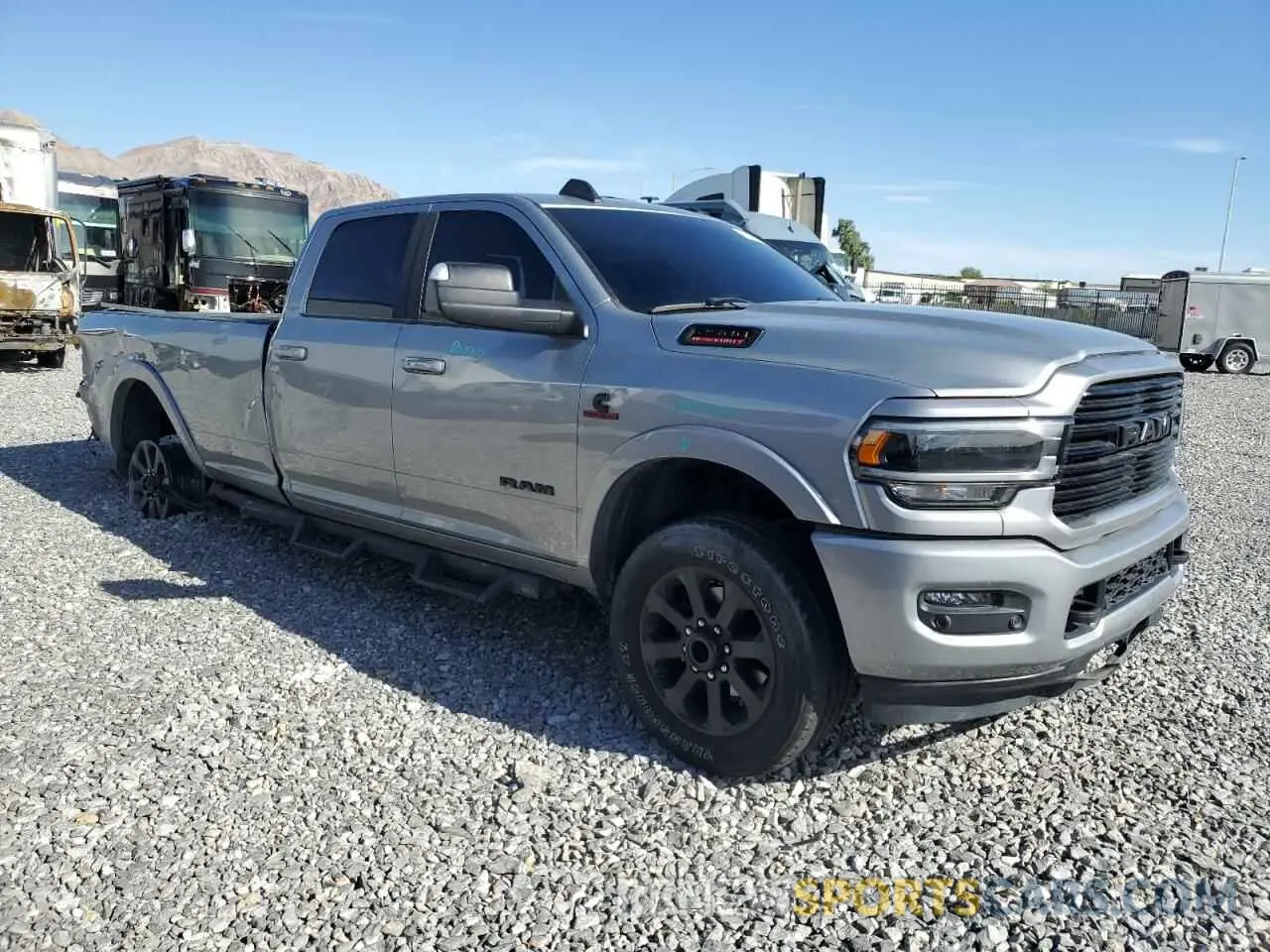 4 Photograph of a damaged car 3C6UR5KL5NG306956 RAM 2500 2022