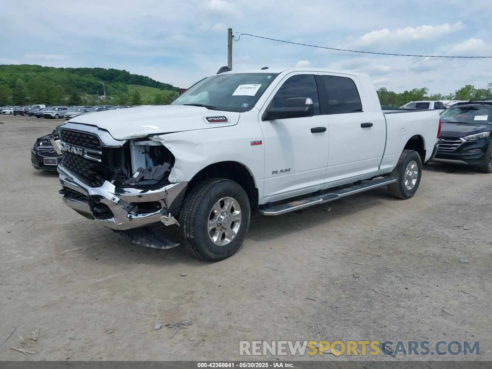 2 Photograph of a damaged car 3C6UR5MJ0NG383441 RAM 2500 2022