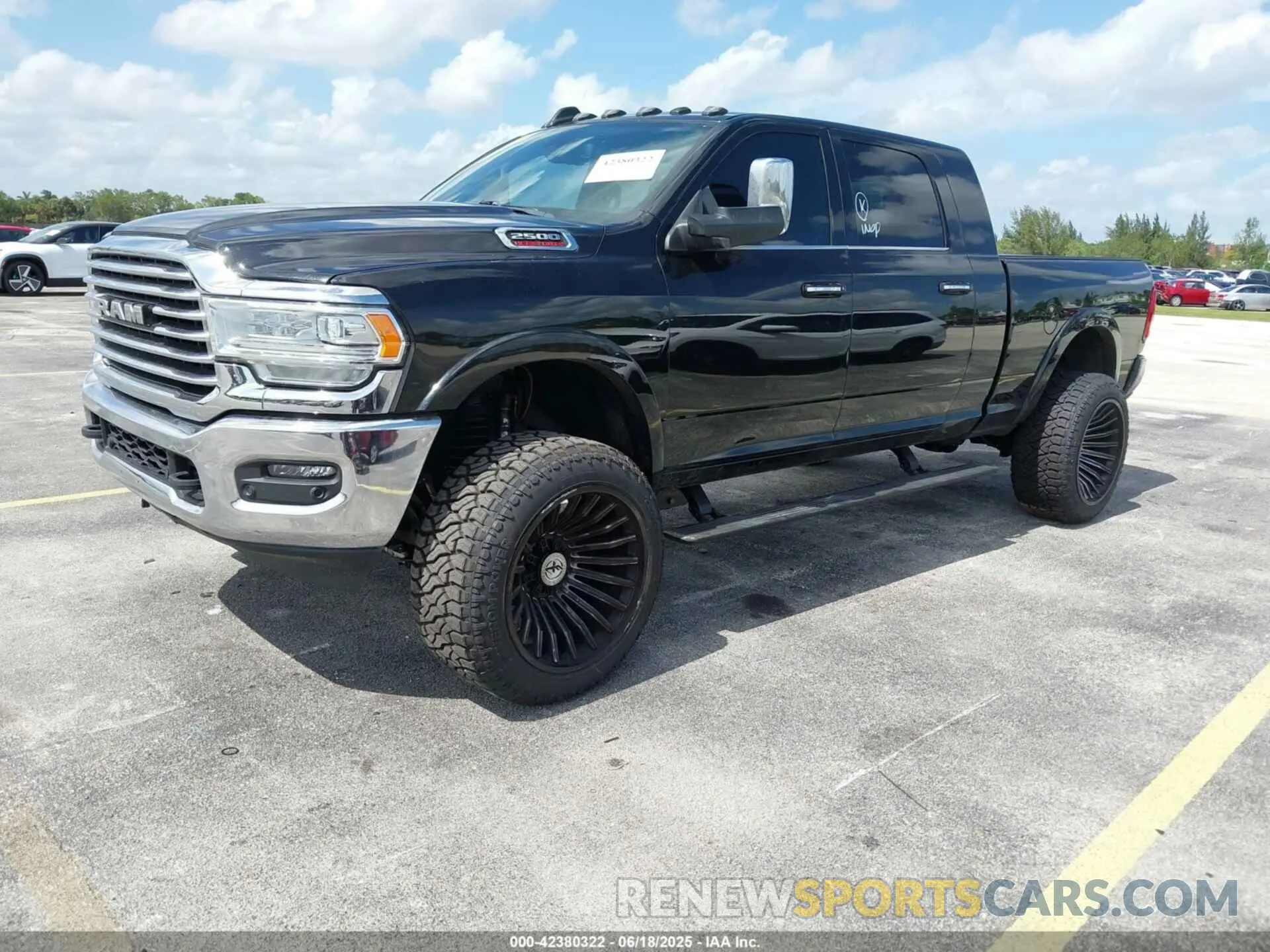 2 Photograph of a damaged car 3C6UR5PL8NG158407 RAM 2500 2022