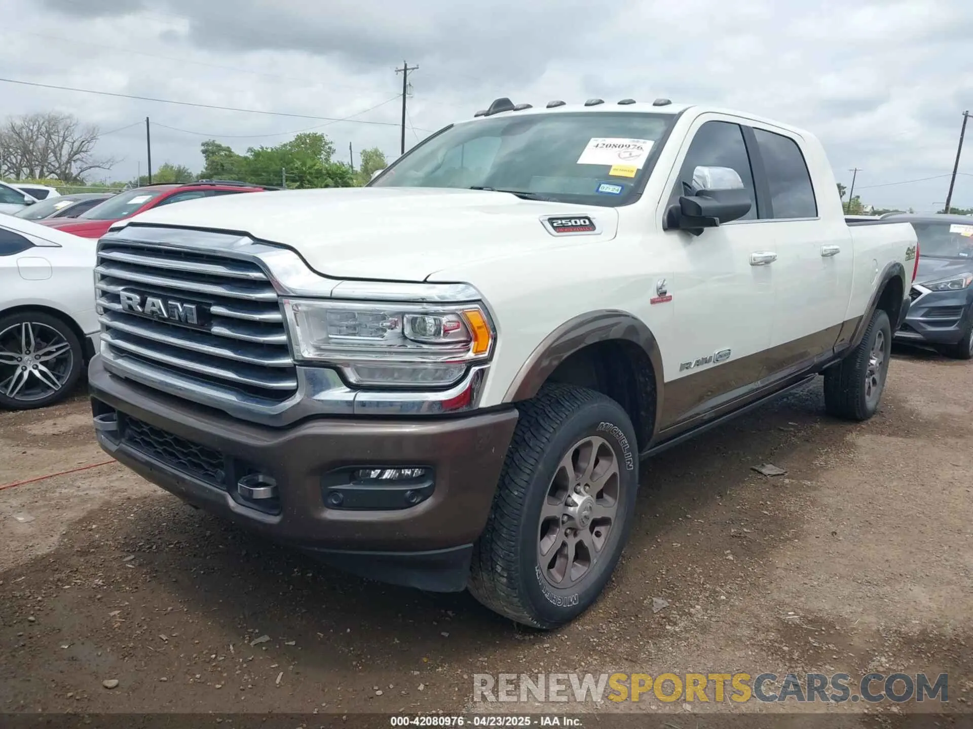 2 Photograph of a damaged car 3C6UR5PL9NG261593 RAM 2500 2022