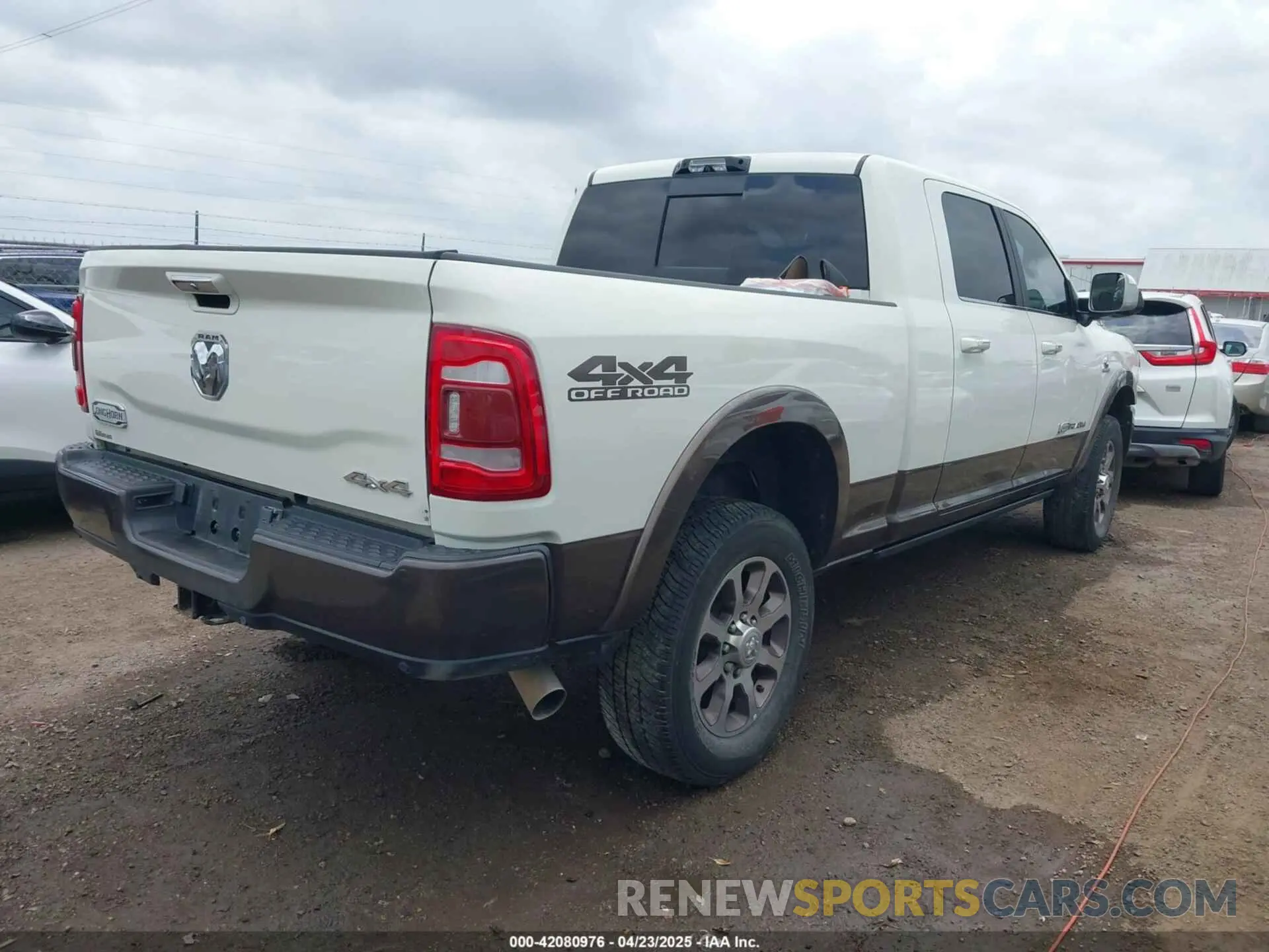 4 Photograph of a damaged car 3C6UR5PL9NG261593 RAM 2500 2022