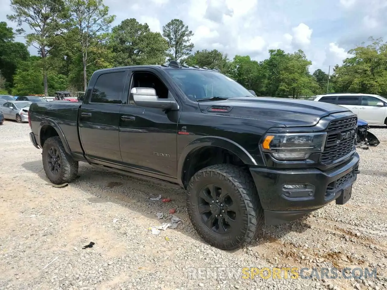 4 Photograph of a damaged car 3C6UR5SL5NG185989 RAM 2500 2022