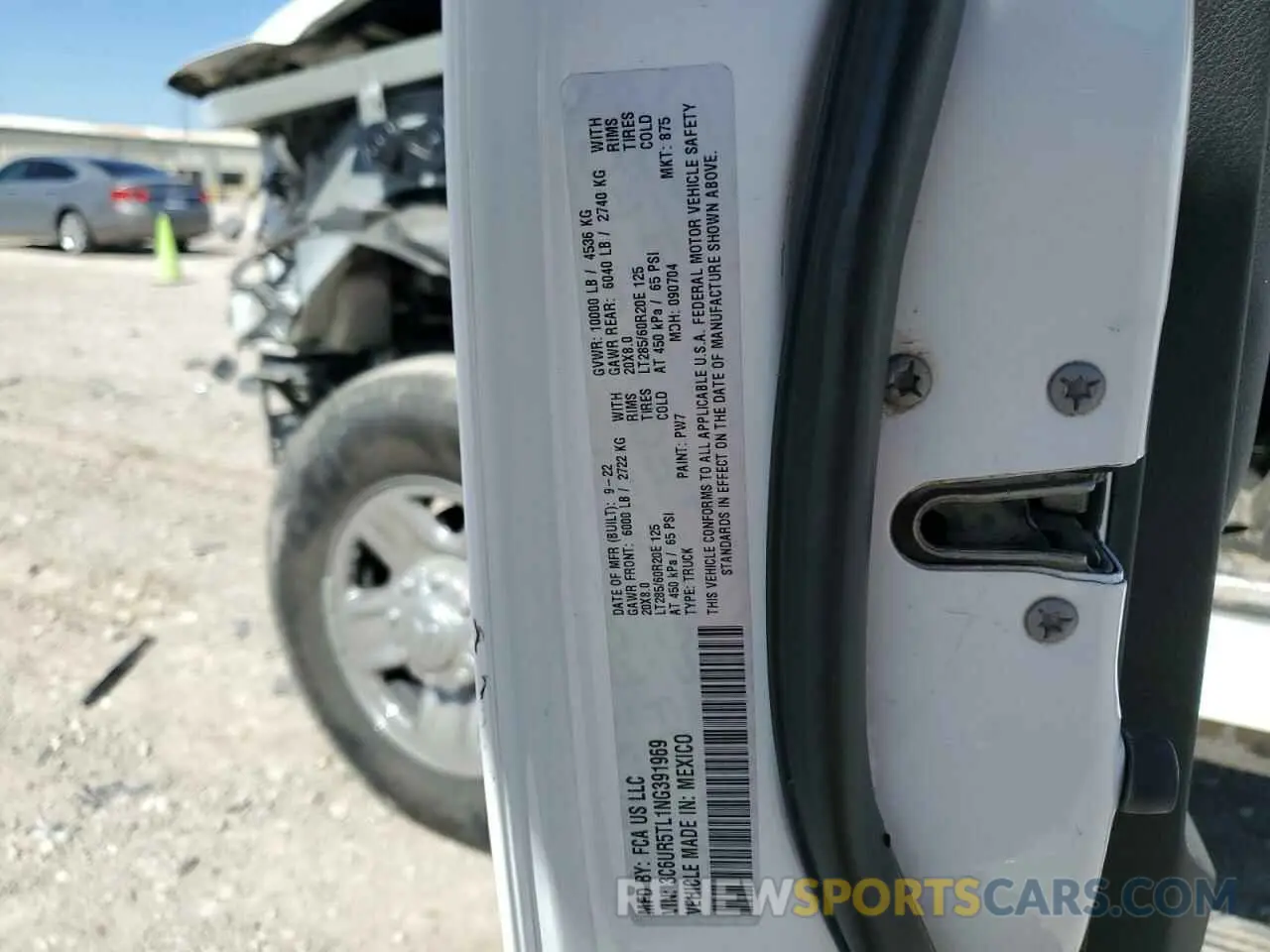 13 Photograph of a damaged car 3C6UR5TL1NG391969 RAM 2500 2022