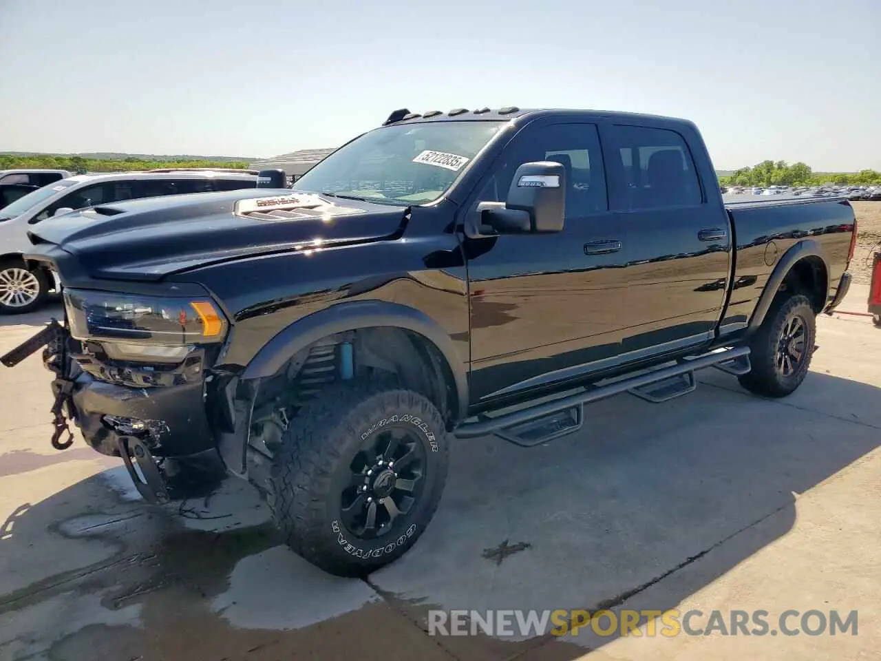 1 Photograph of a damaged car 3C6TR5EJXPG569677 RAM 2500 2023
