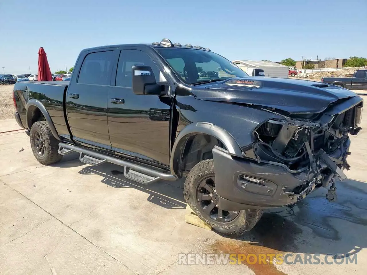 4 Photograph of a damaged car 3C6TR5EJXPG569677 RAM 2500 2023