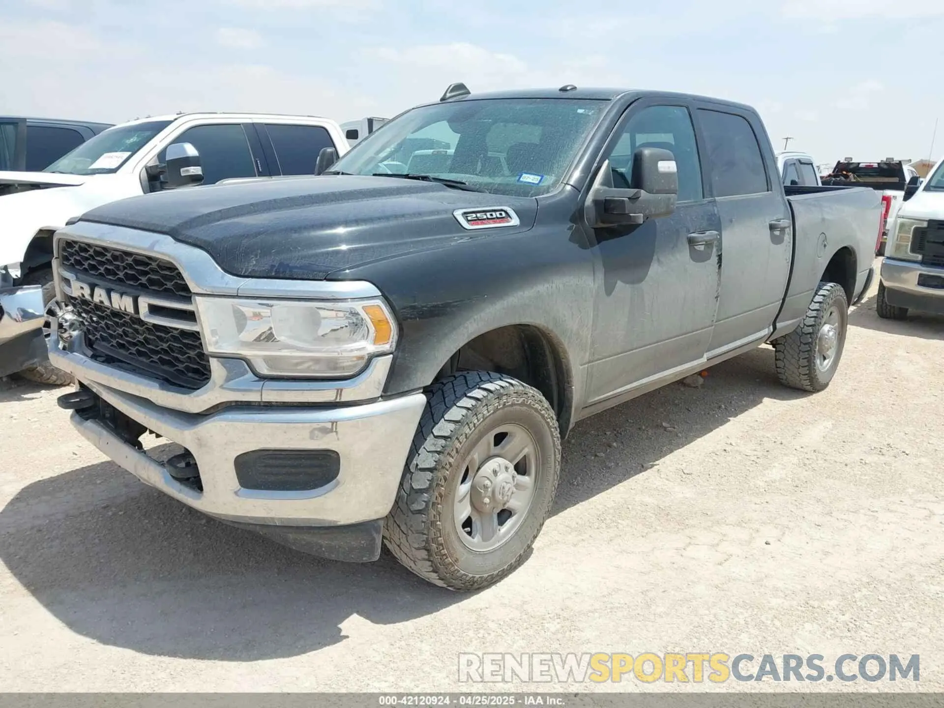 2 Photograph of a damaged car 3C6UR5CJ2PG532744 RAM 2500 2023