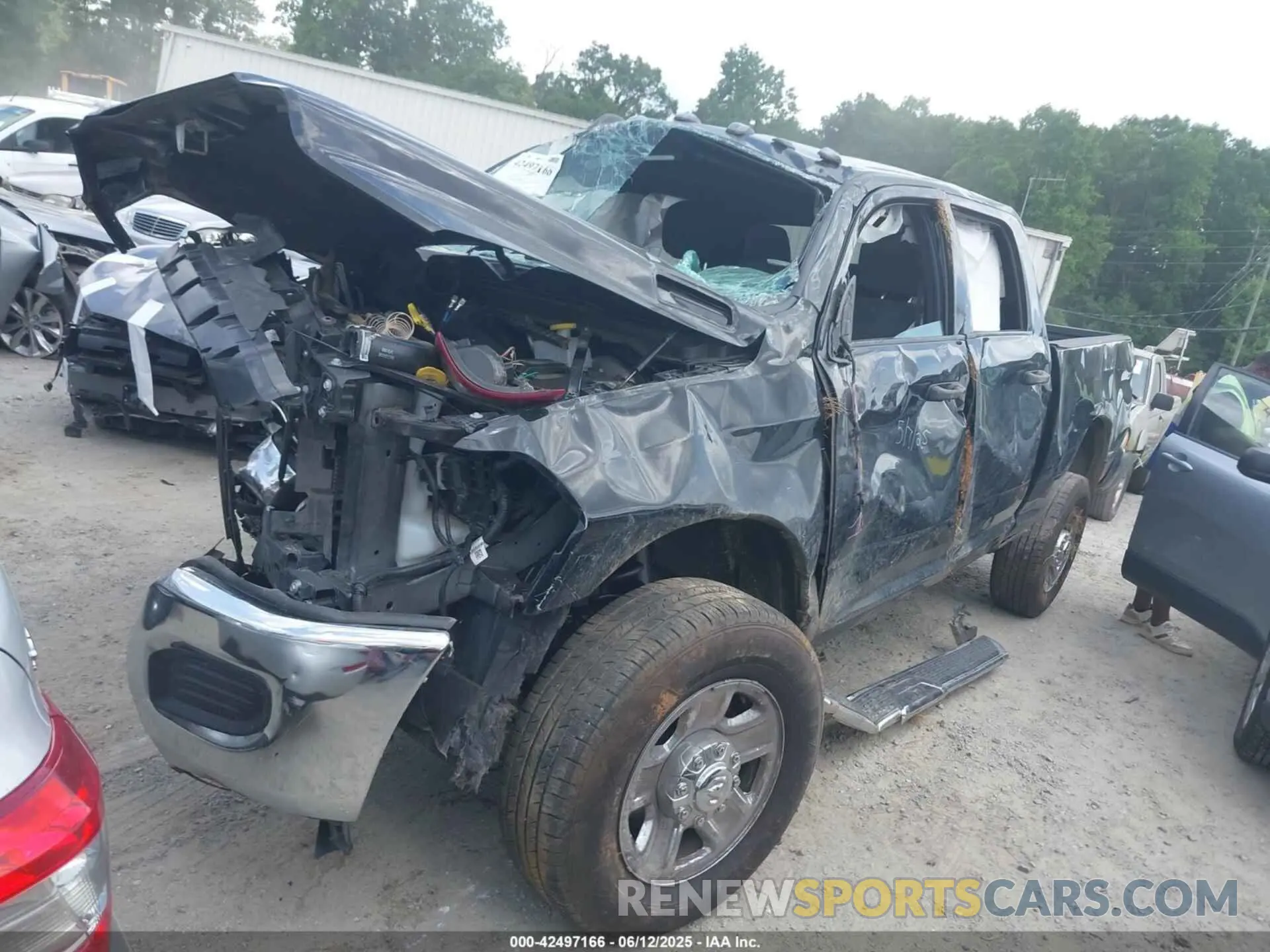 2 Photograph of a damaged car 3C6UR5CJ4PG503729 RAM 2500 2023