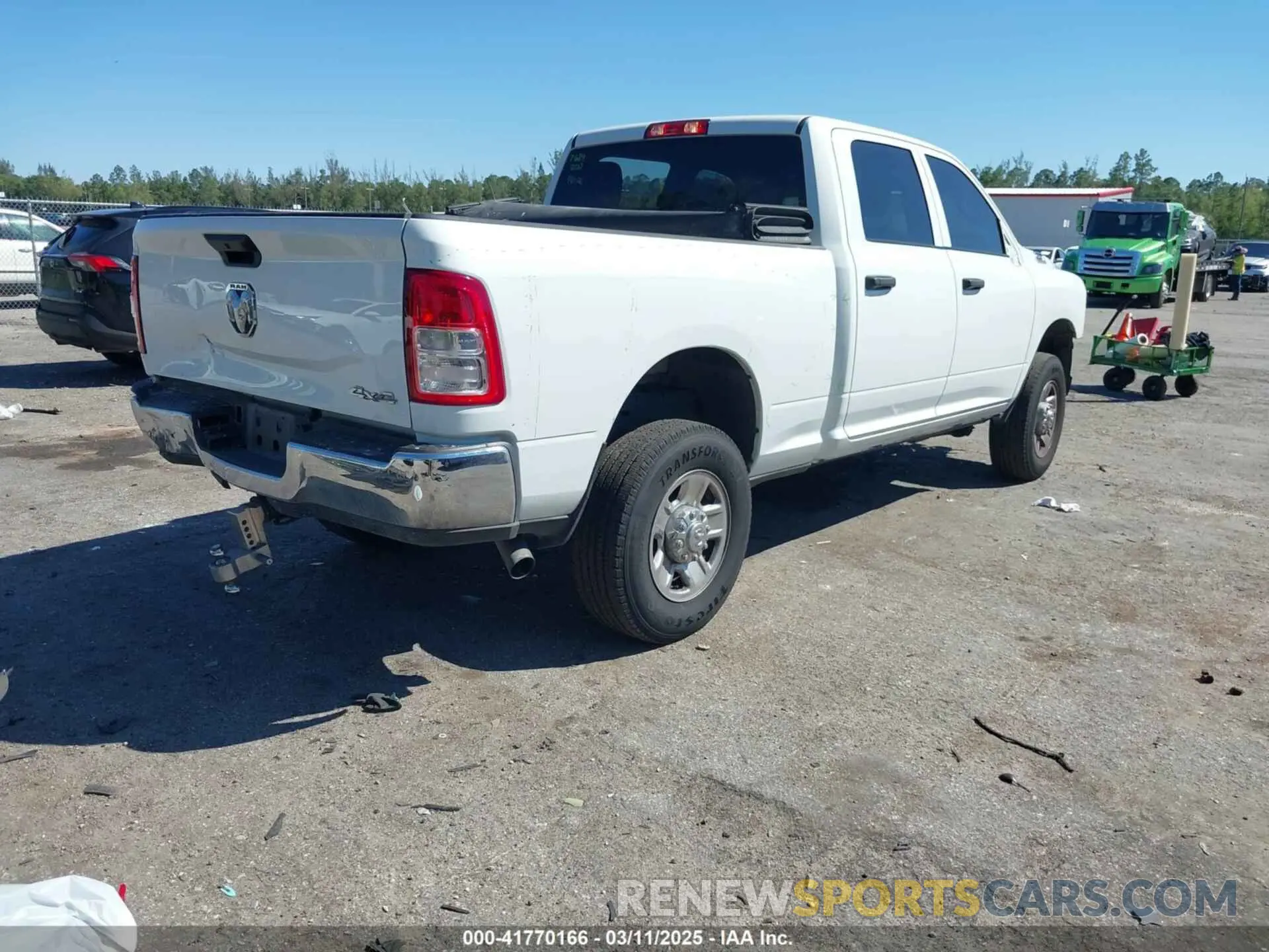 4 Photograph of a damaged car 3C6UR5CJ6PG517275 RAM 2500 2023