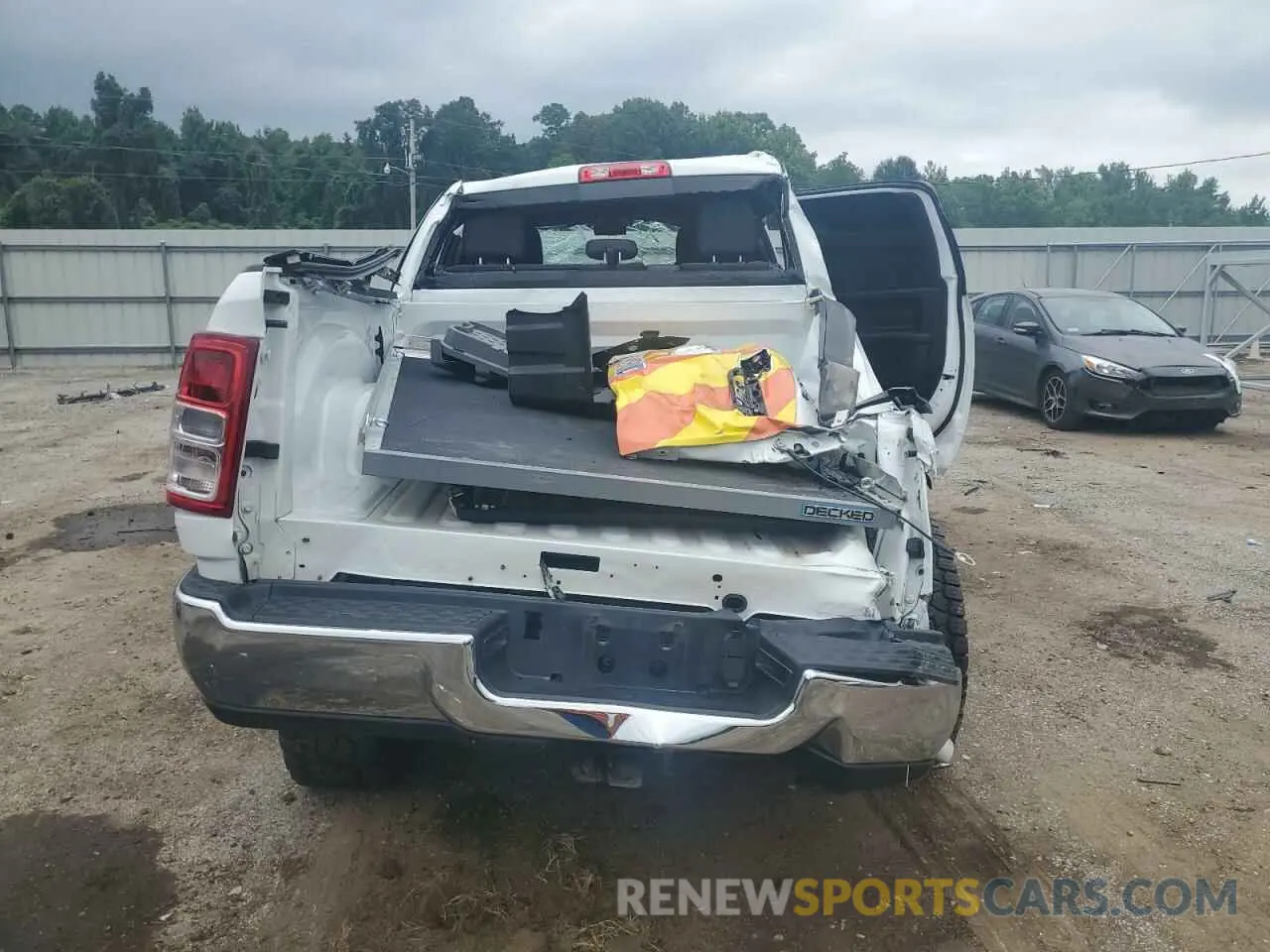 6 Photograph of a damaged car 3C6UR5CJ9PG614227 RAM 2500 2023