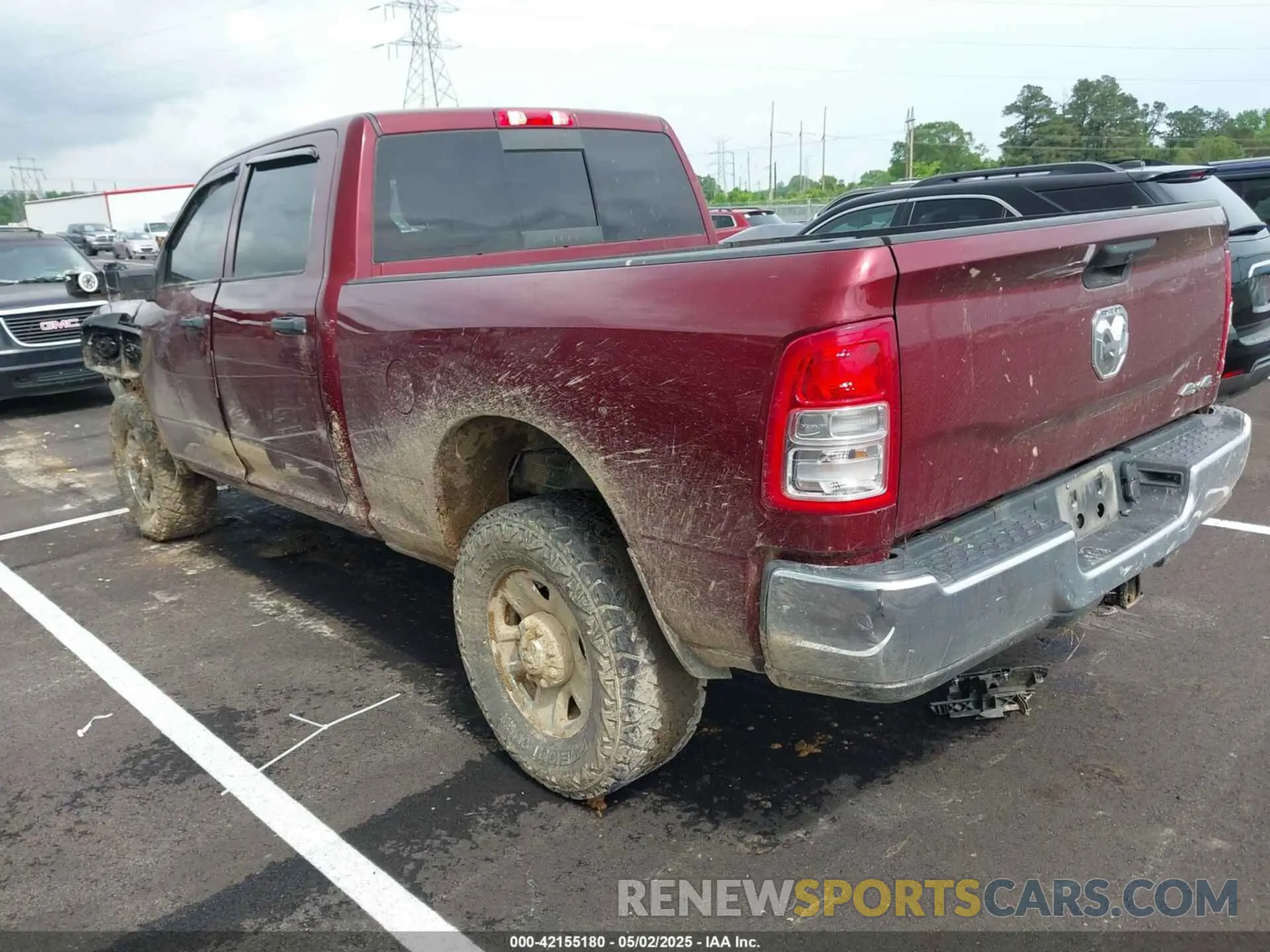 3 Photograph of a damaged car 3C6UR5CL3PG504534 RAM 2500 2023