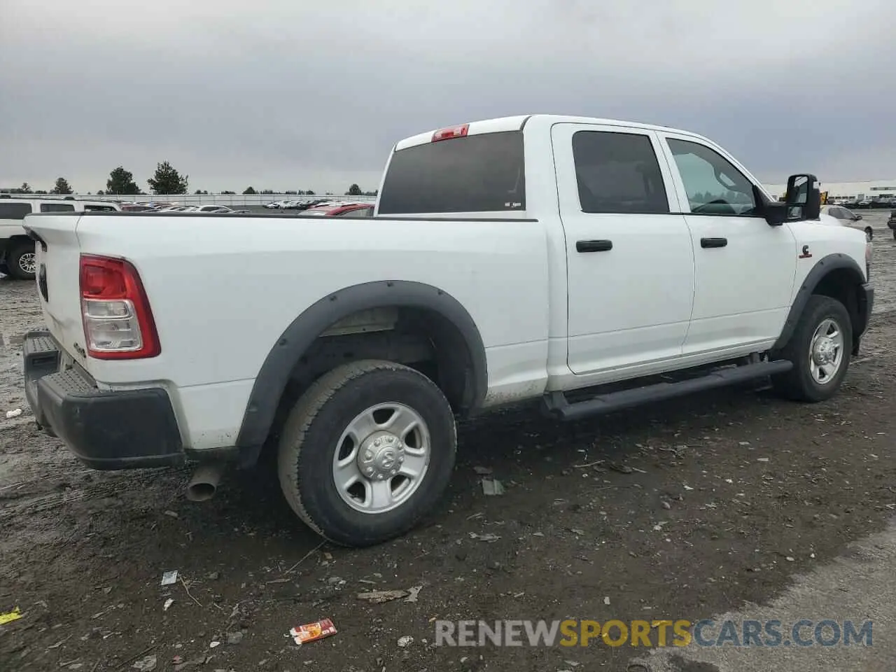 3 Photograph of a damaged car 3C6UR5CL3PG582280 RAM 2500 2023