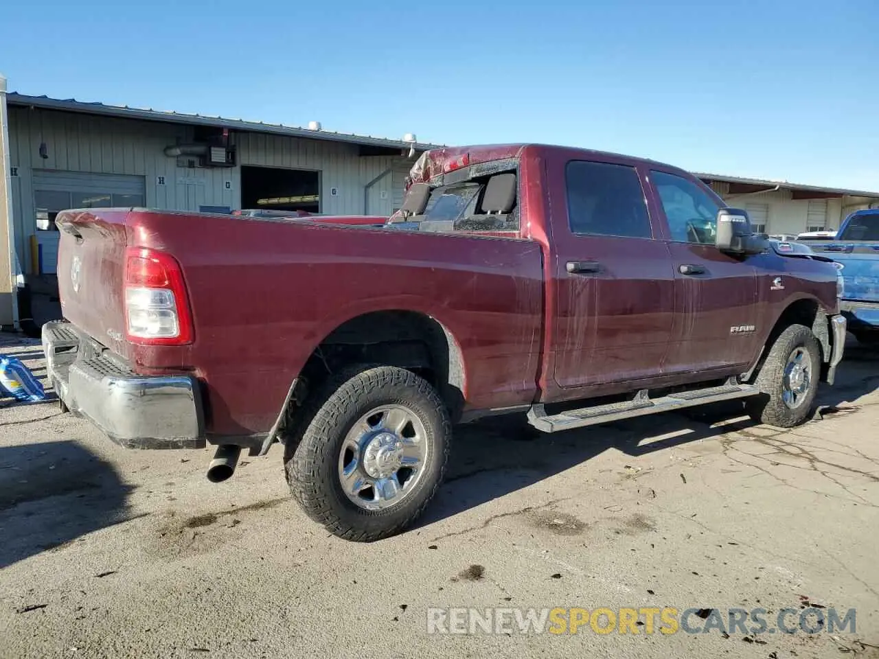 3 Photograph of a damaged car 3C6UR5CL4PG539521 RAM 2500 2023
