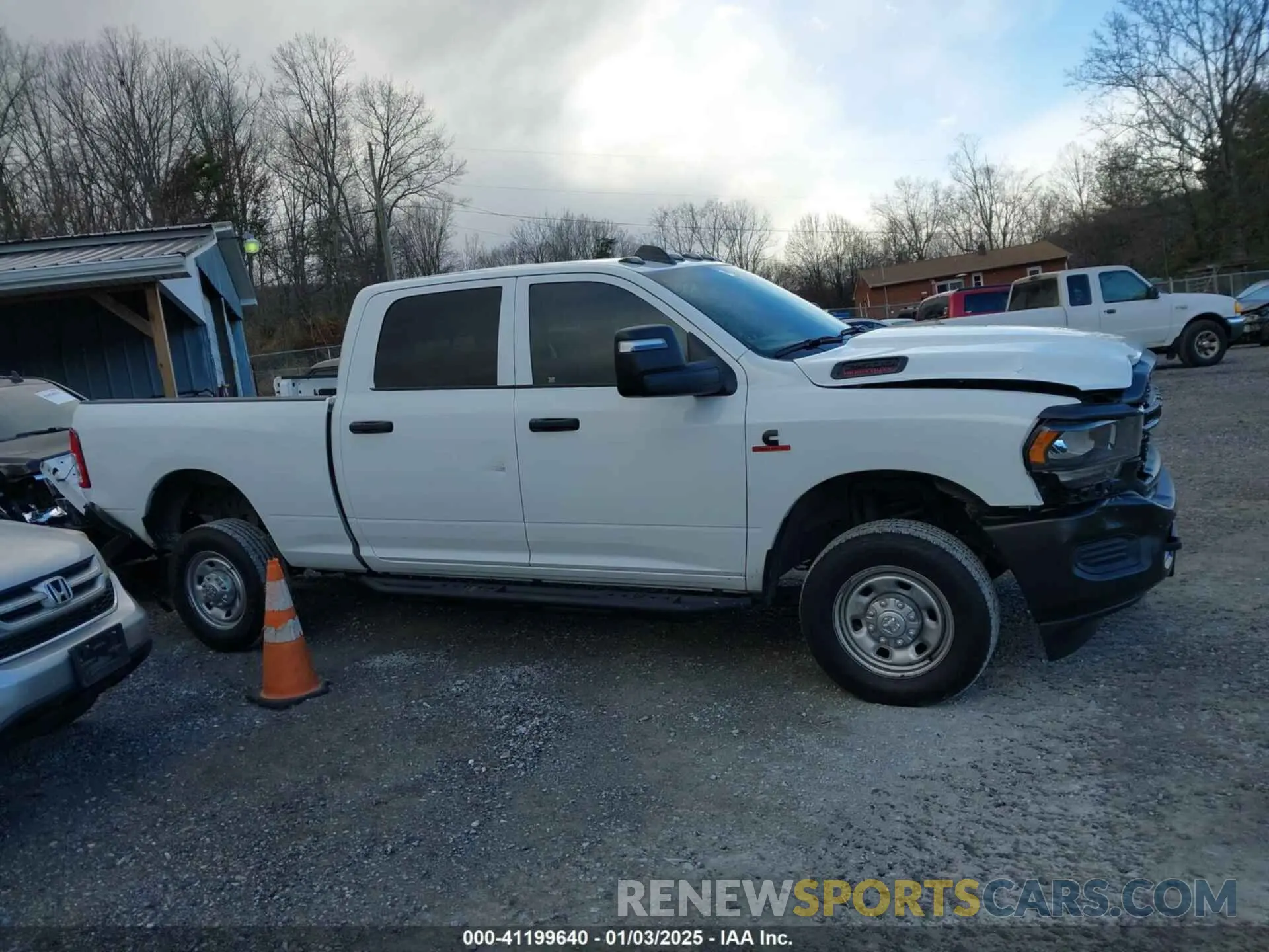14 Photograph of a damaged car 3C6UR5CL5PG517155 RAM 2500 2023