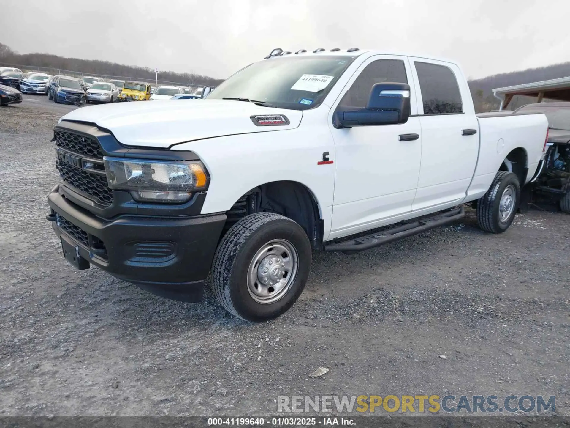 2 Photograph of a damaged car 3C6UR5CL5PG517155 RAM 2500 2023