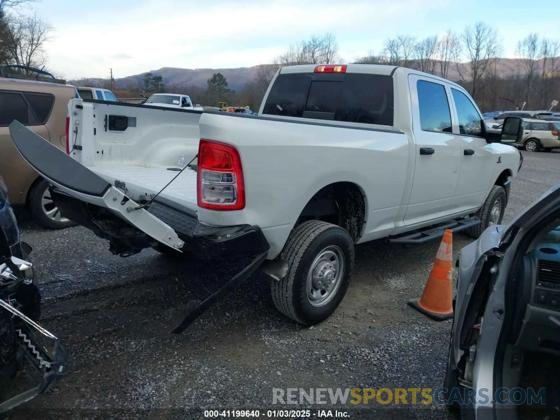 4 Photograph of a damaged car 3C6UR5CL5PG517155 RAM 2500 2023