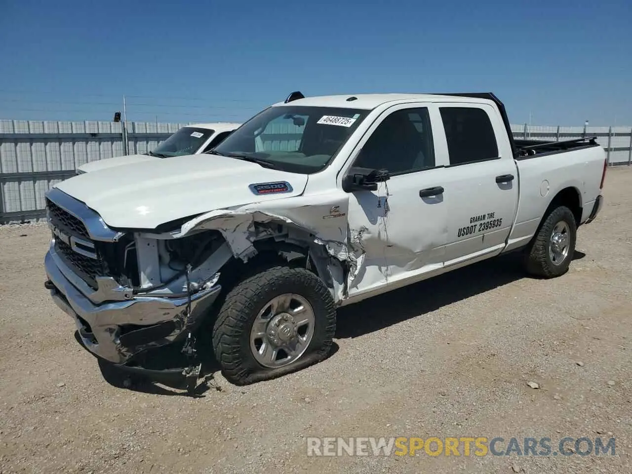 1 Photograph of a damaged car 3C6UR5CL7PG538704 RAM 2500 2023
