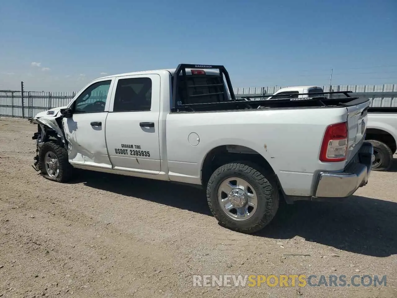 2 Photograph of a damaged car 3C6UR5CL7PG538704 RAM 2500 2023