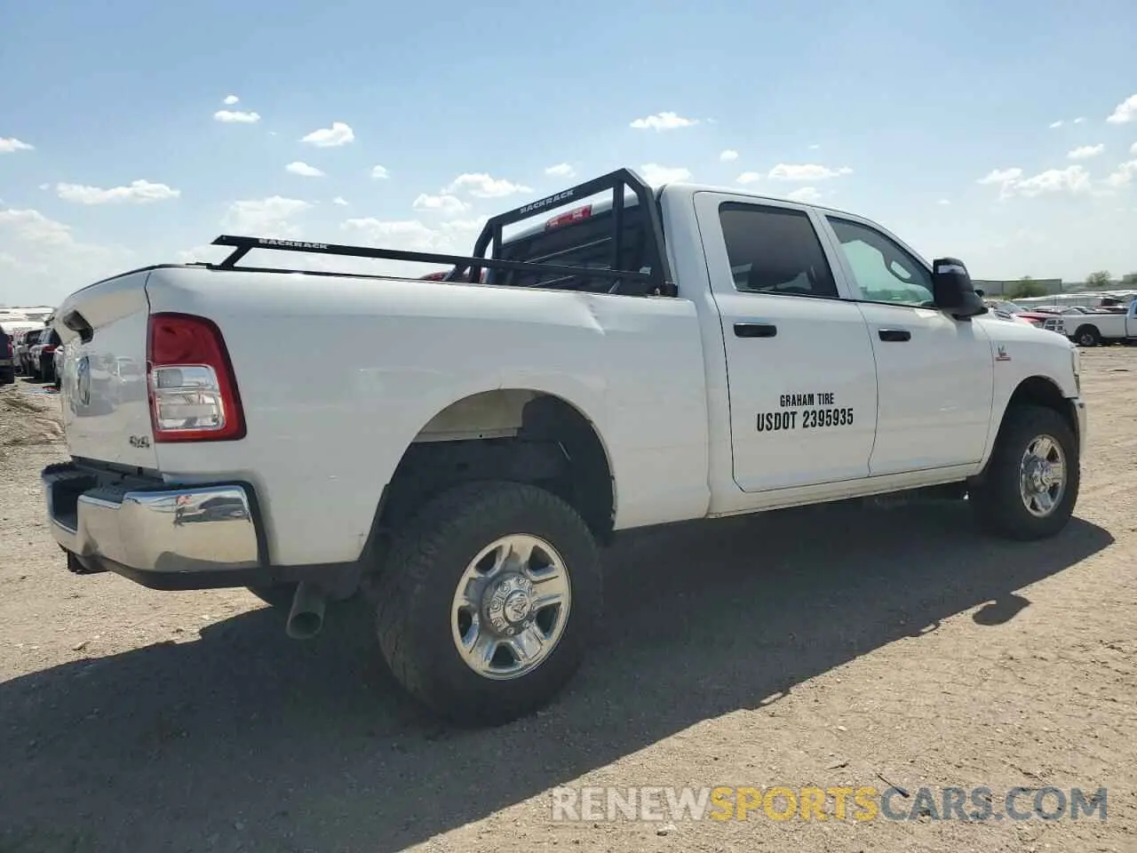 3 Photograph of a damaged car 3C6UR5CL7PG538704 RAM 2500 2023