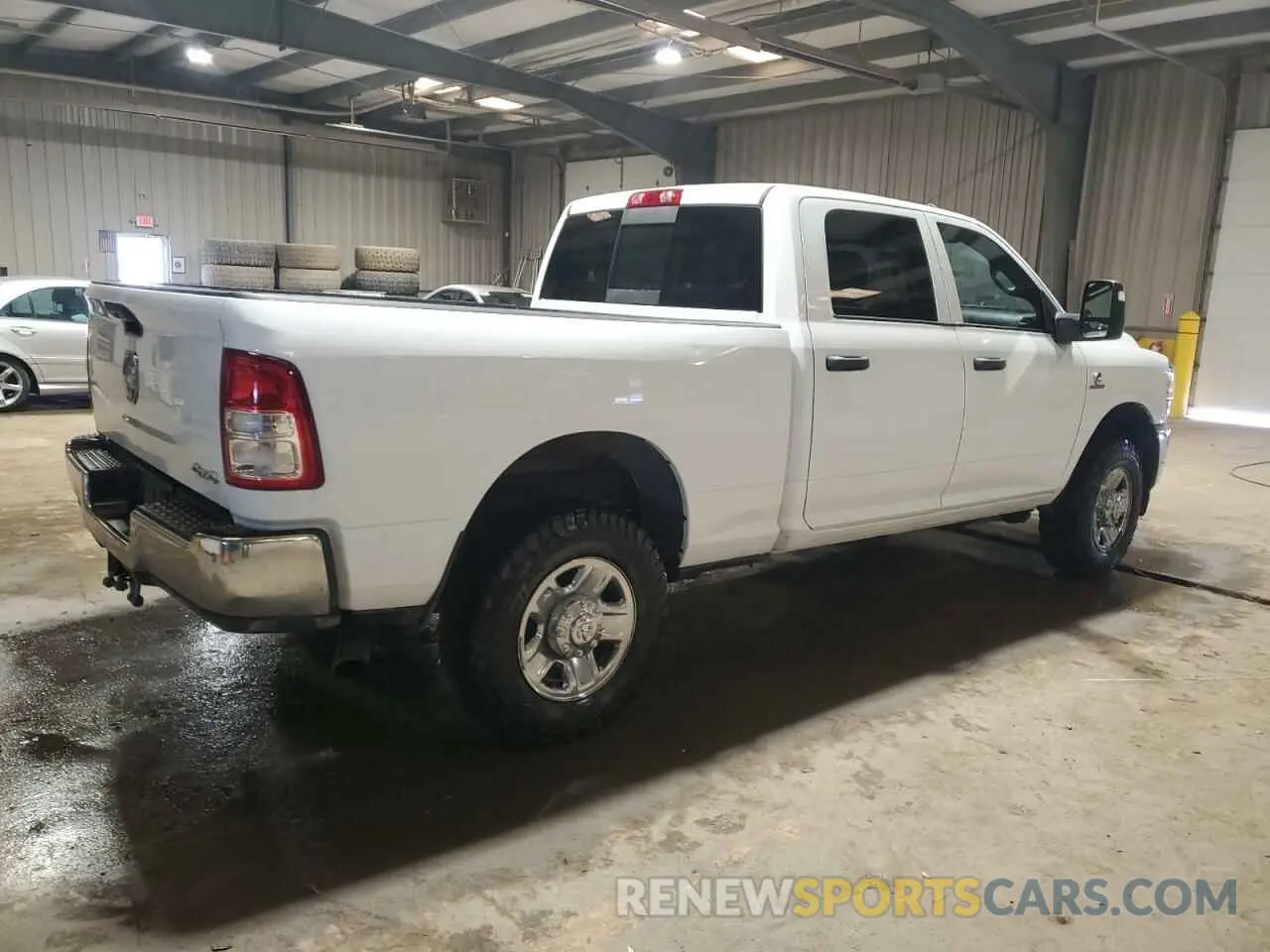 3 Photograph of a damaged car 3C6UR5CLXPG500318 RAM 2500 2023