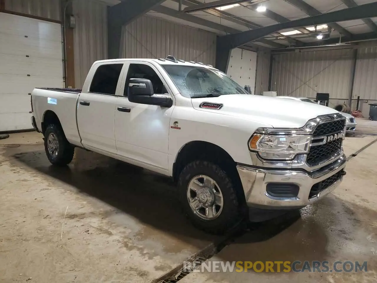 4 Photograph of a damaged car 3C6UR5CLXPG500318 RAM 2500 2023