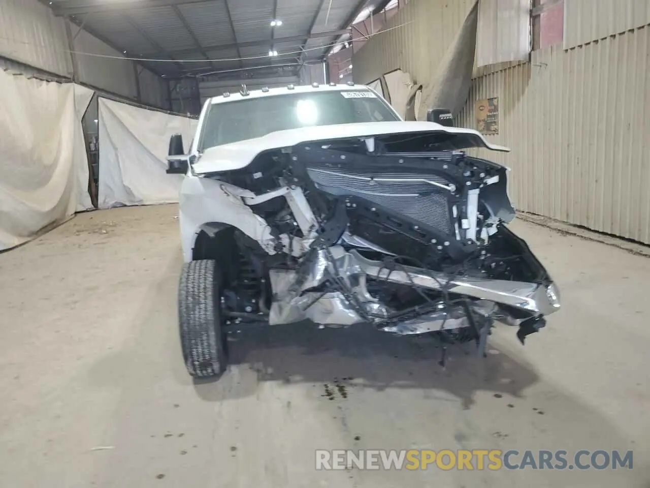 5 Photograph of a damaged car 3C6UR5DJ1PG542986 RAM 2500 2023