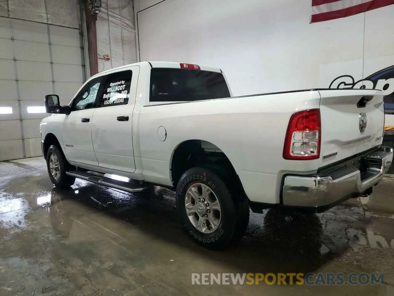 2 Photograph of a damaged car 3C6UR5DJ4PG610858 RAM 2500 2023