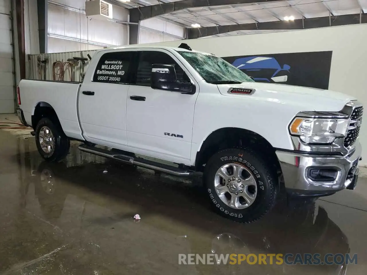 4 Photograph of a damaged car 3C6UR5DJ4PG610858 RAM 2500 2023