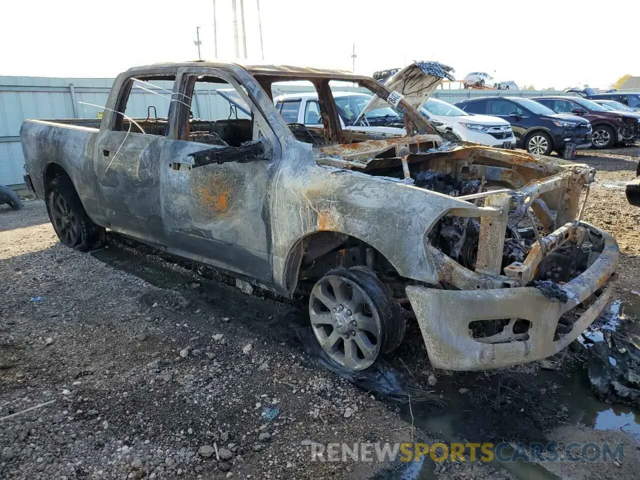 4 Photograph of a damaged car 3C6UR5DJ6PG591827 RAM 2500 2023