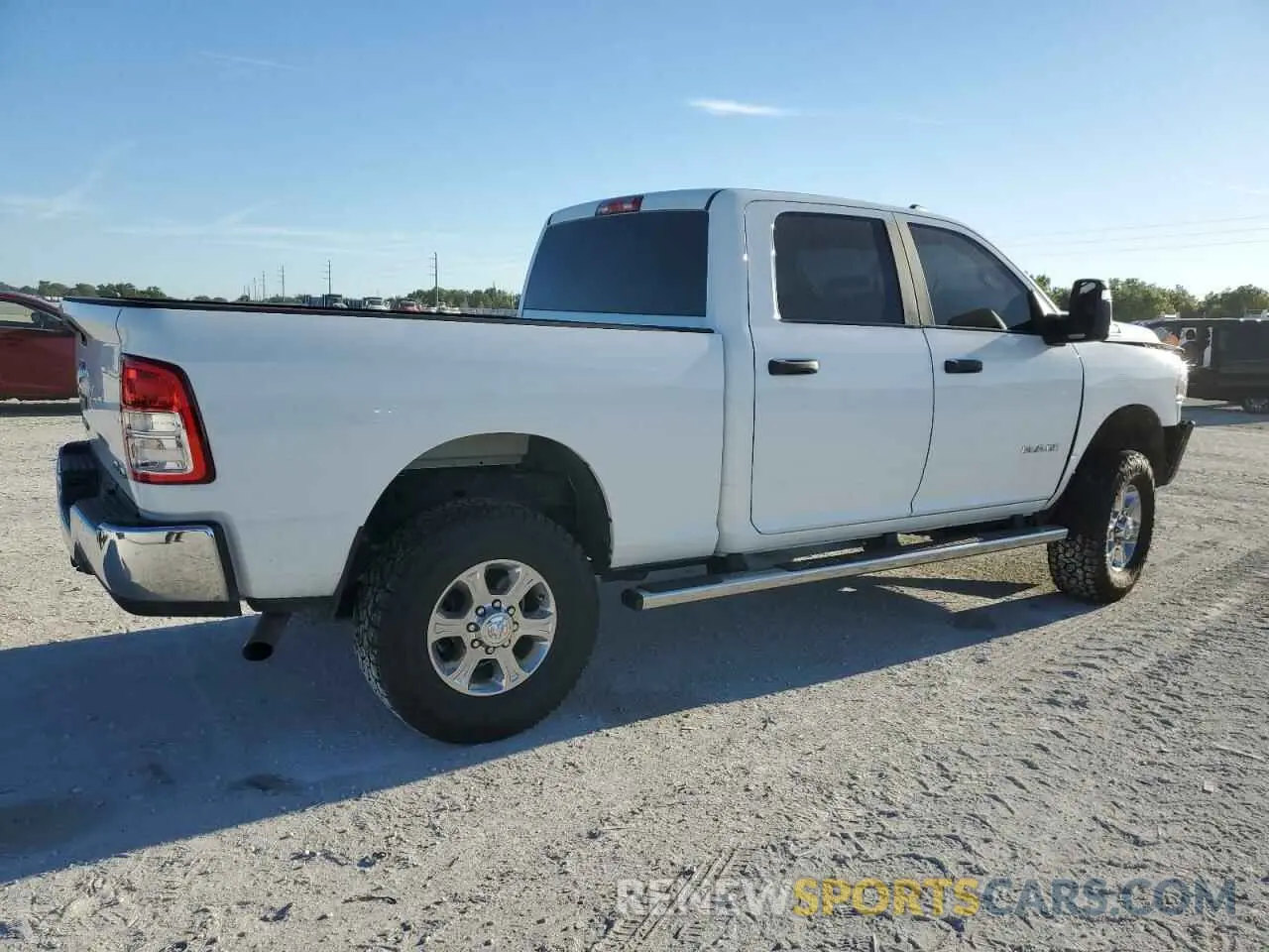 3 Photograph of a damaged car 3C6UR5DJ9PG568512 RAM 2500 2023