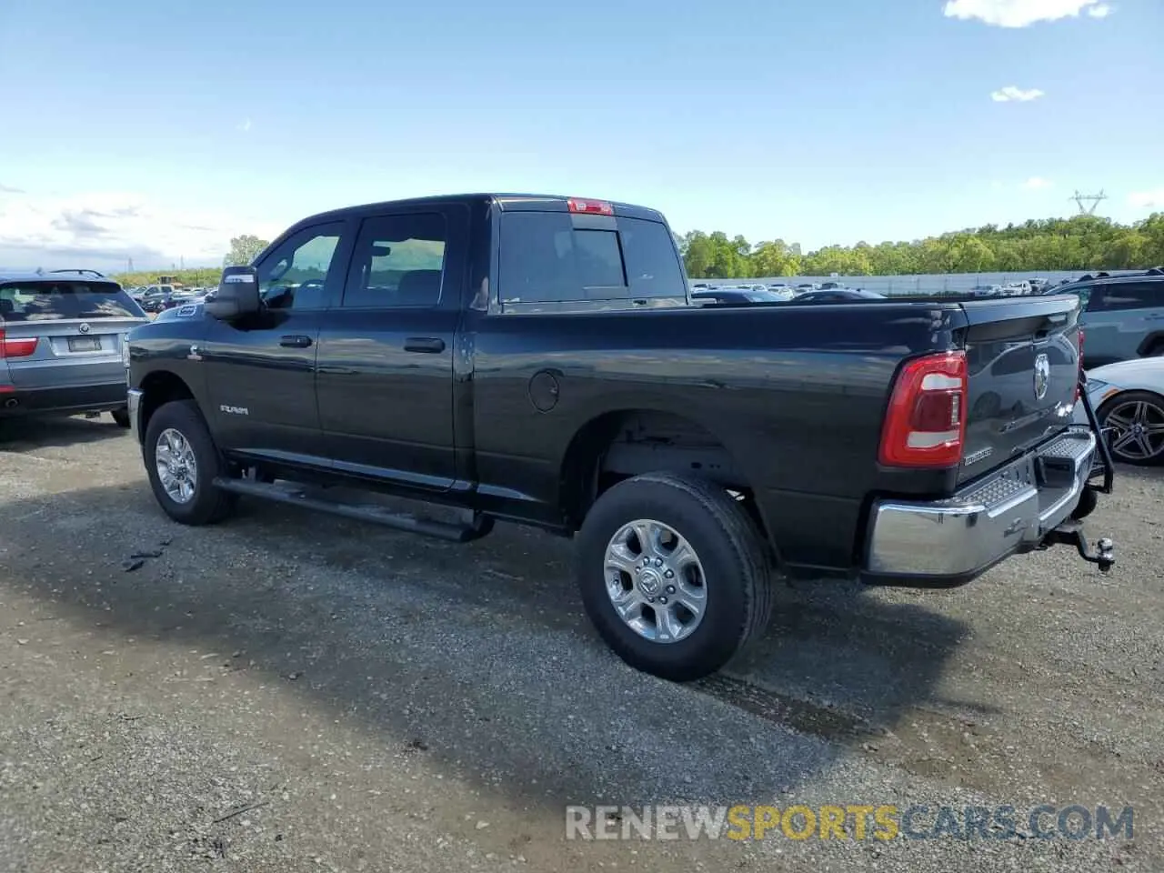 2 Photograph of a damaged car 3C6UR5DL0PG517627 RAM 2500 2023