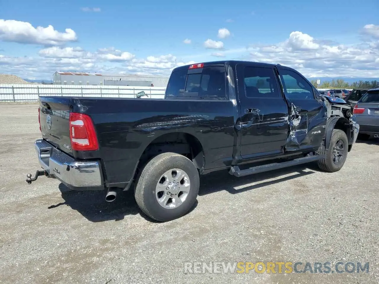 3 Photograph of a damaged car 3C6UR5DL0PG517627 RAM 2500 2023