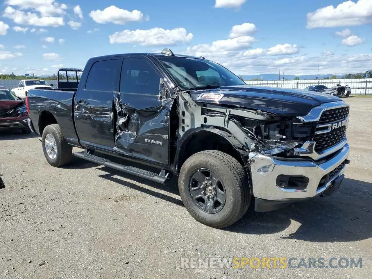 4 Photograph of a damaged car 3C6UR5DL0PG517627 RAM 2500 2023
