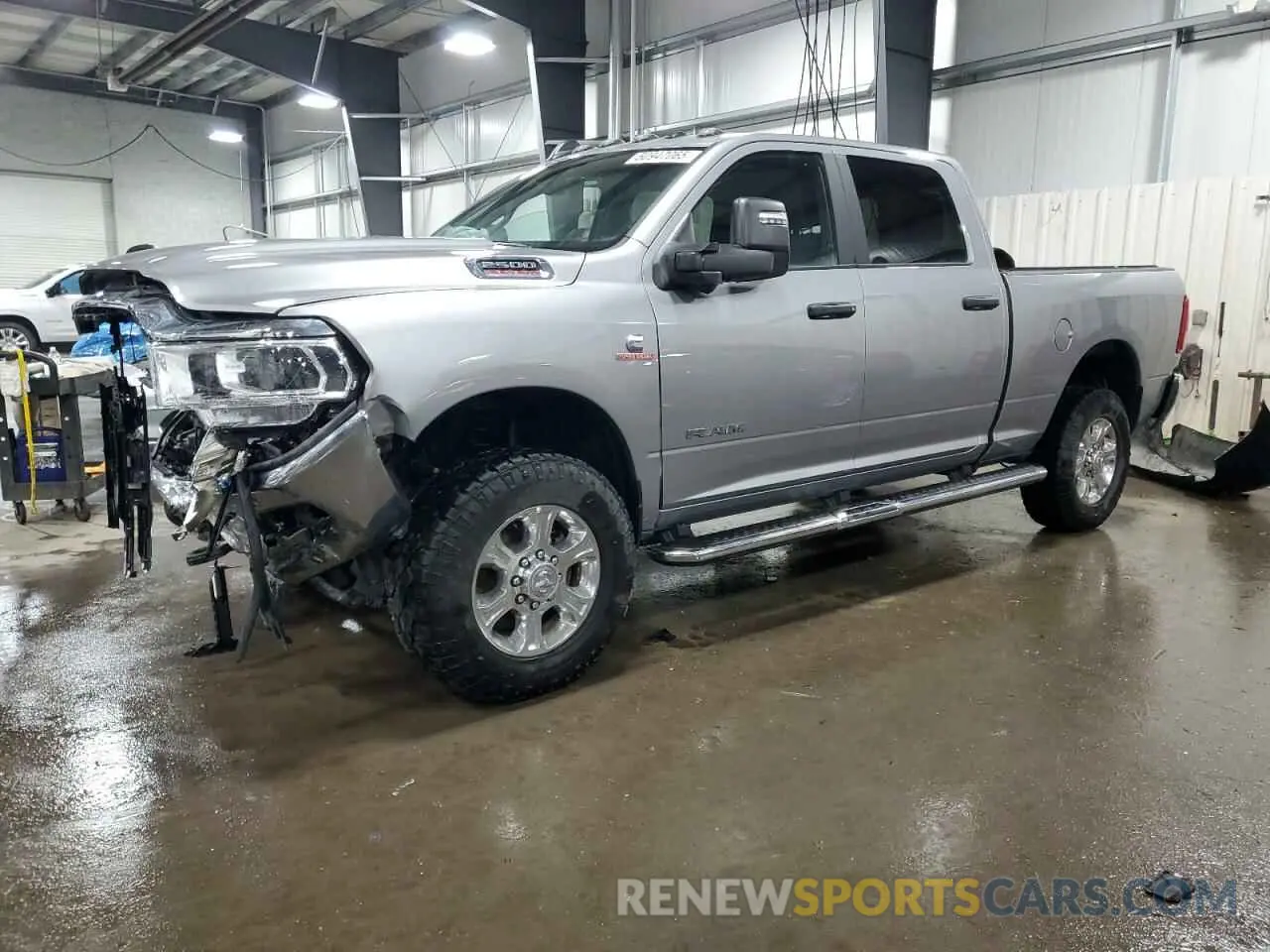 1 Photograph of a damaged car 3C6UR5DL0PG547212 RAM 2500 2023