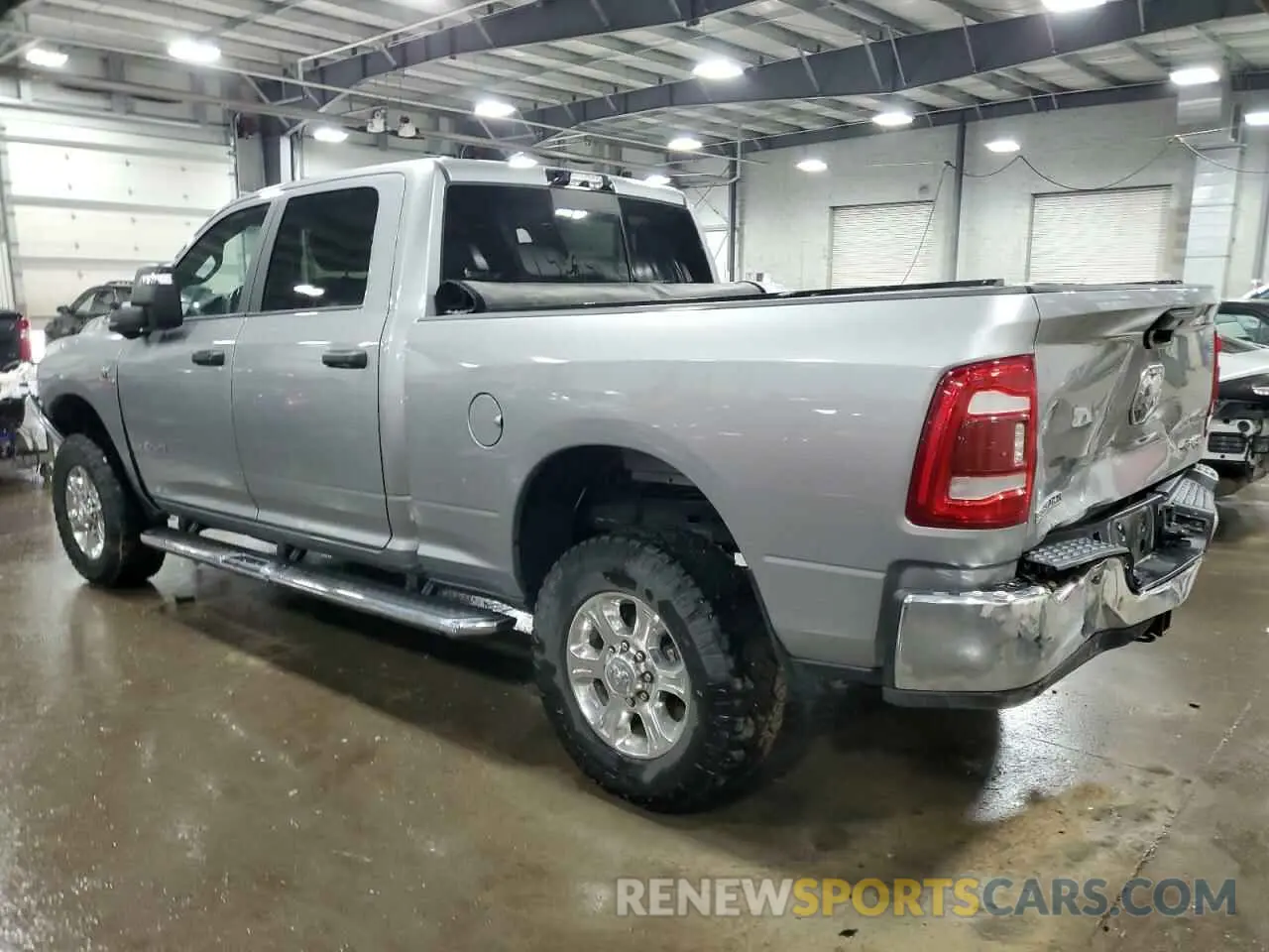 2 Photograph of a damaged car 3C6UR5DL0PG547212 RAM 2500 2023