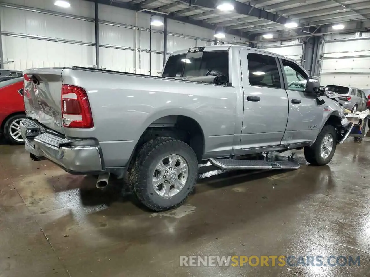 3 Photograph of a damaged car 3C6UR5DL0PG547212 RAM 2500 2023