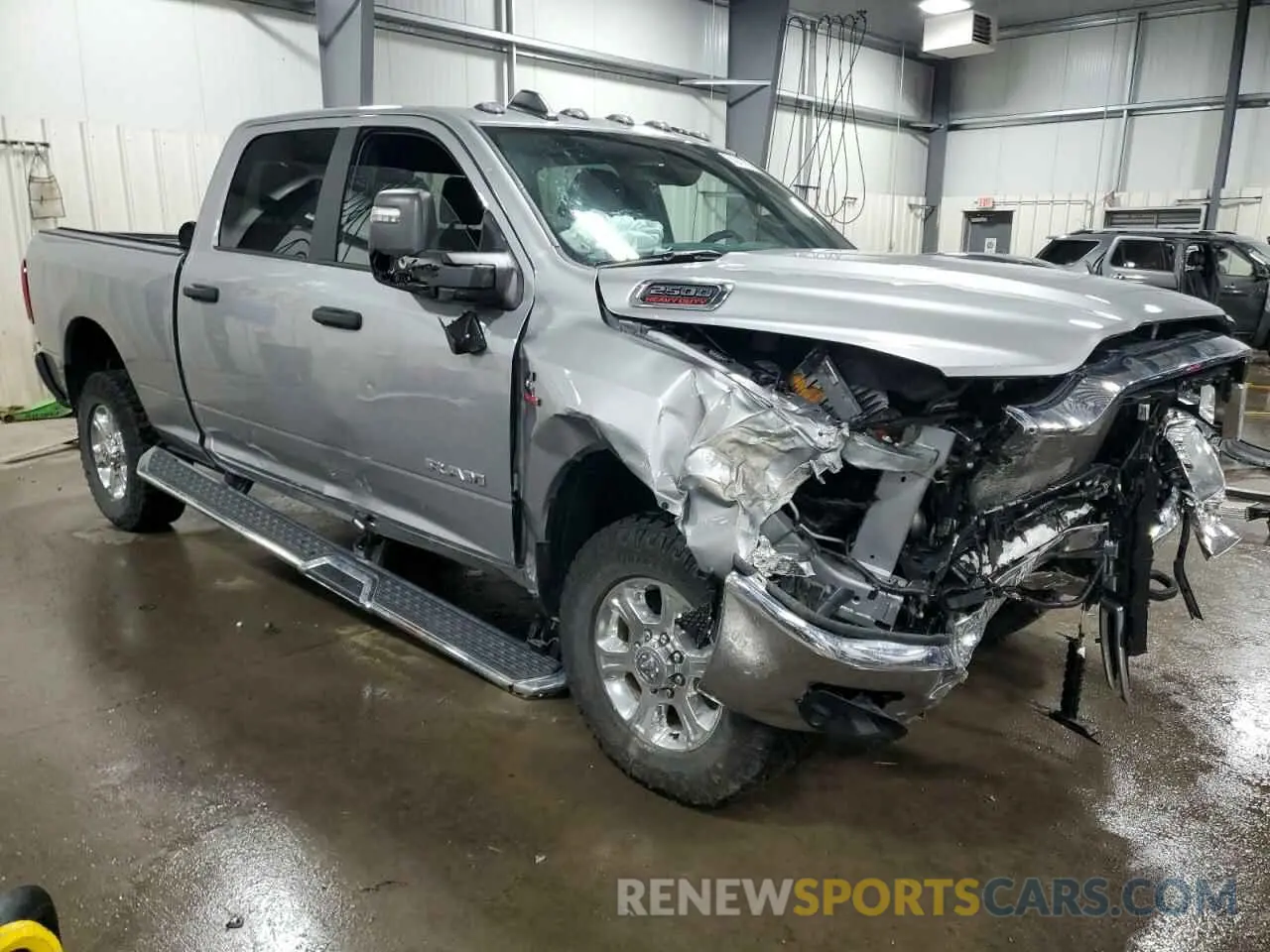 4 Photograph of a damaged car 3C6UR5DL0PG547212 RAM 2500 2023