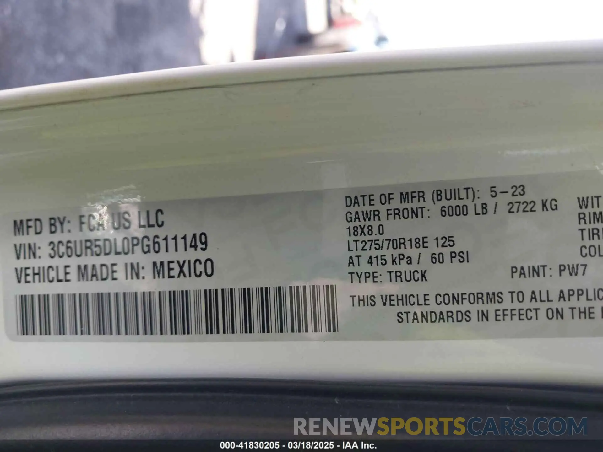 9 Photograph of a damaged car 3C6UR5DL0PG611149 RAM 2500 2023