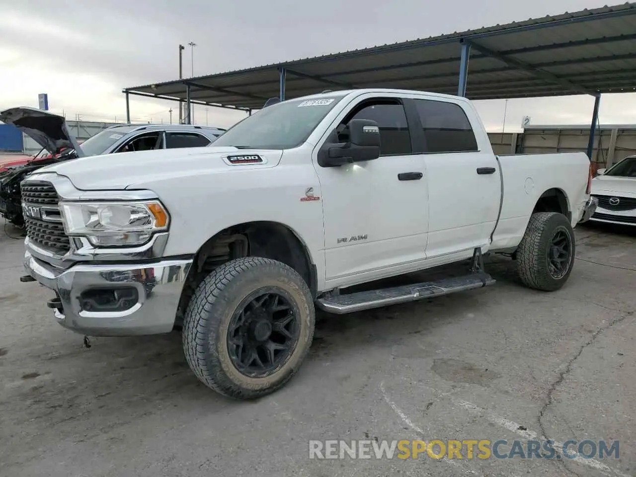 1 Photograph of a damaged car 3C6UR5DL0PG613323 RAM 2500 2023