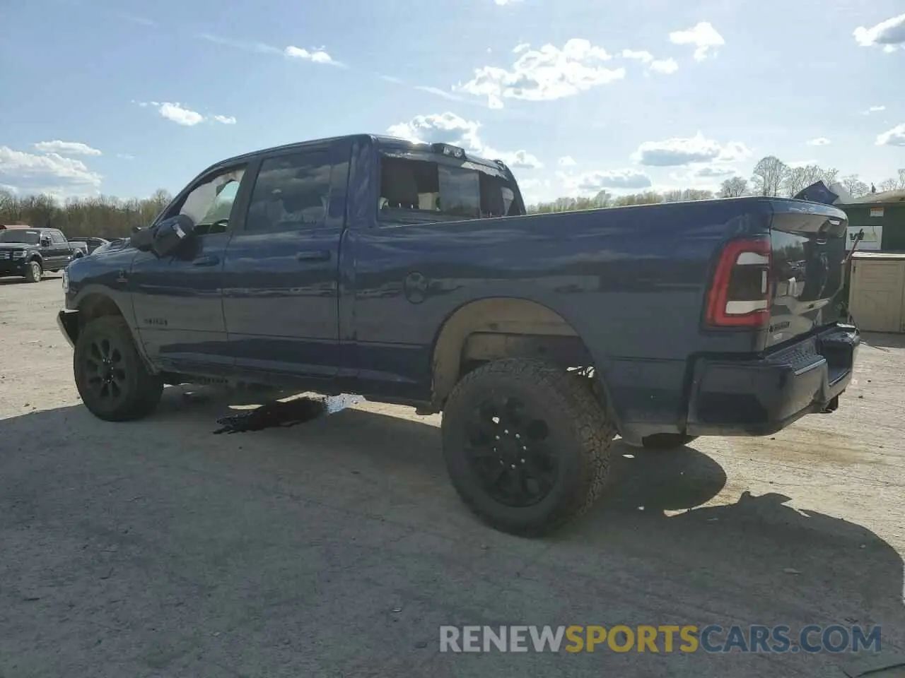 2 Photograph of a damaged car 3C6UR5DL0PG617792 RAM 2500 2023