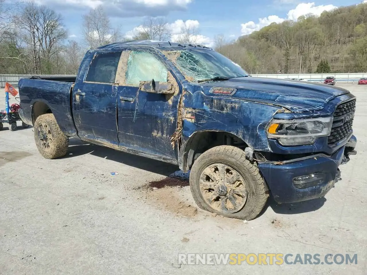 4 Photograph of a damaged car 3C6UR5DL0PG617792 RAM 2500 2023