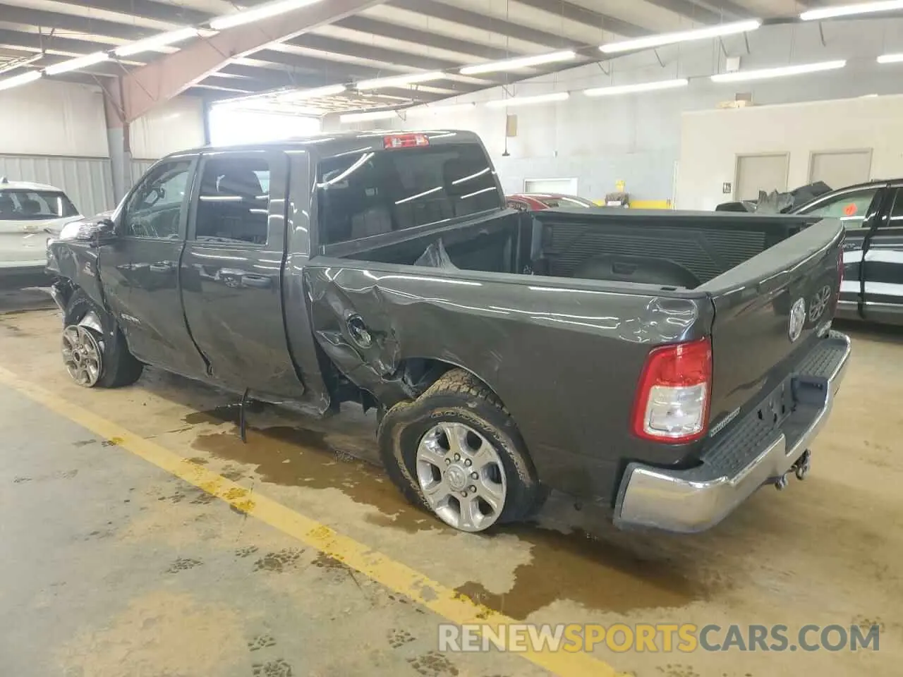 2 Photograph of a damaged car 3C6UR5DL1PG540186 RAM 2500 2023