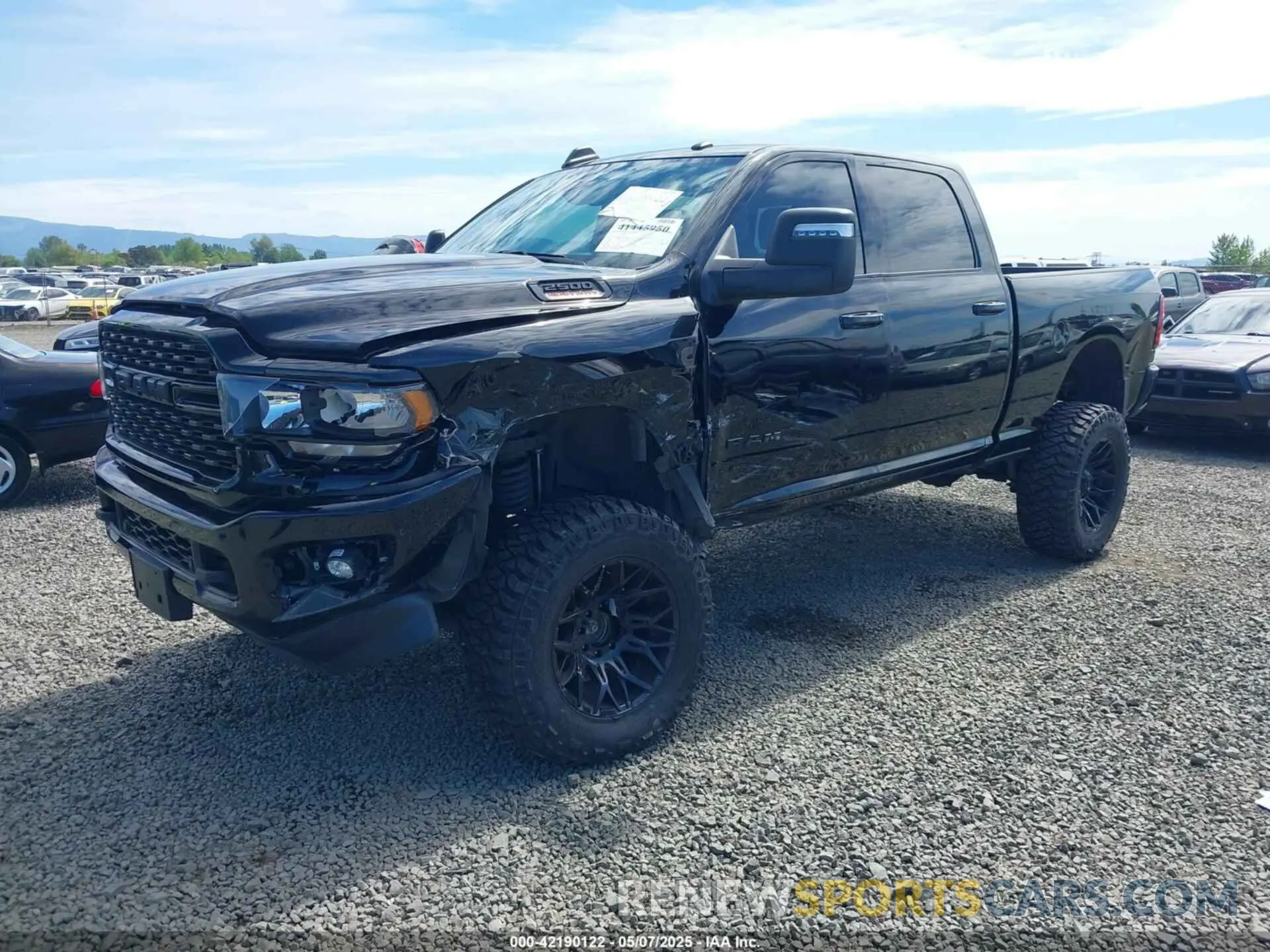 2 Photograph of a damaged car 3C6UR5DL3PG635901 RAM 2500 2023