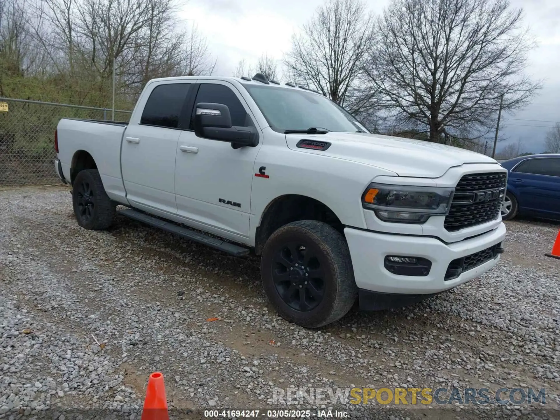 1 Photograph of a damaged car 3C6UR5DL4PG529196 RAM 2500 2023