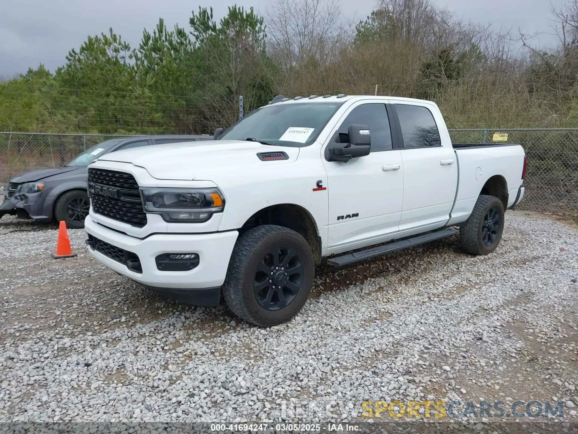 2 Photograph of a damaged car 3C6UR5DL4PG529196 RAM 2500 2023