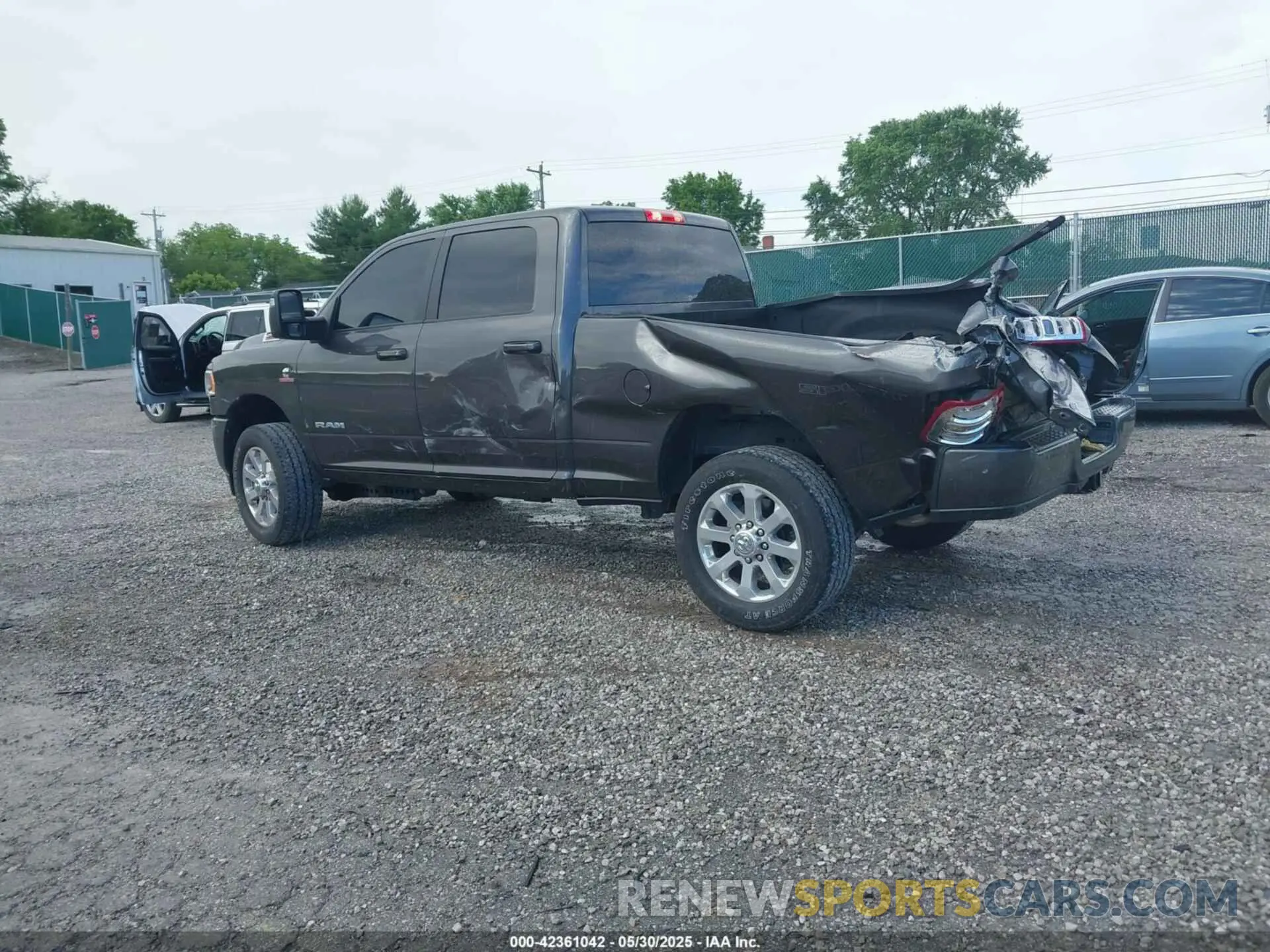 3 Photograph of a damaged car 3C6UR5DL5PG628593 RAM 2500 2023