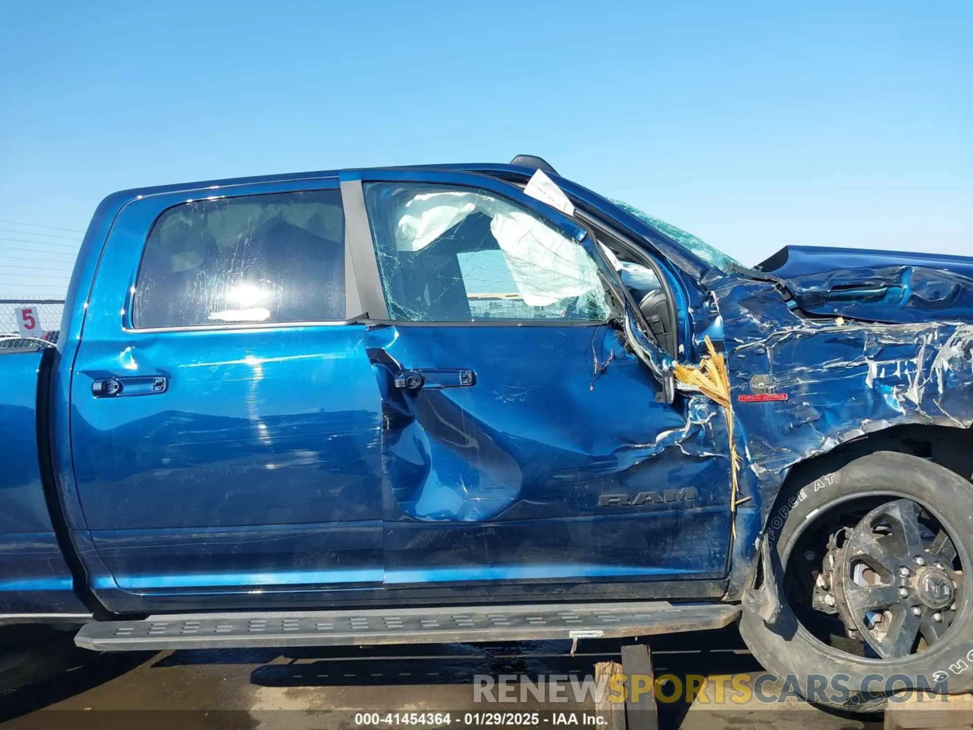 12 Photograph of a damaged car 3C6UR5DL5PG651615 RAM 2500 2023
