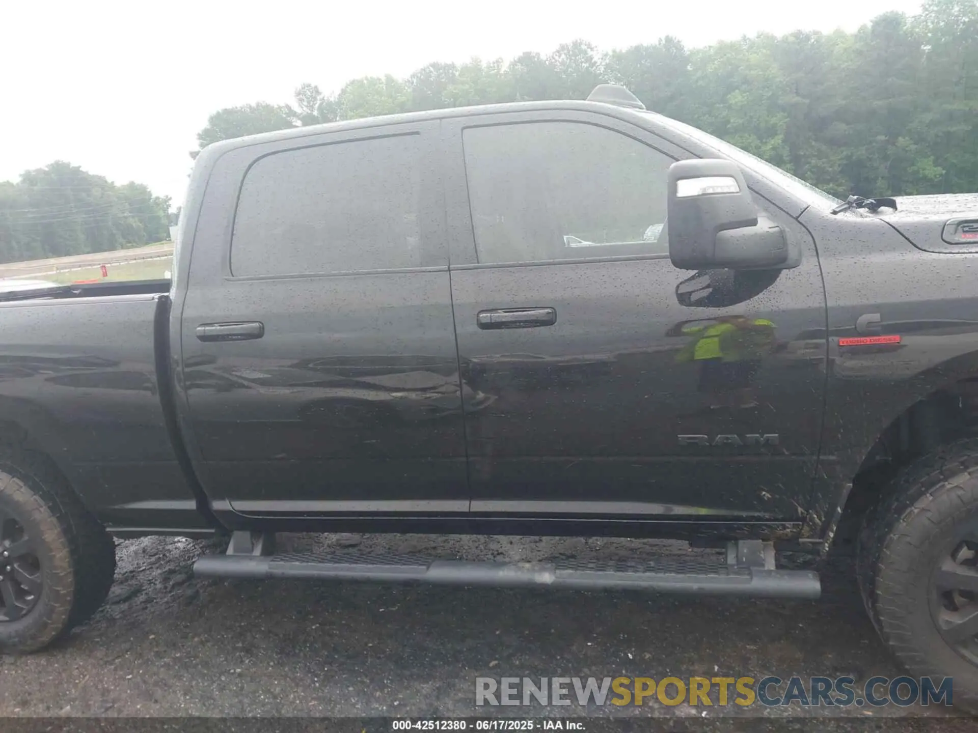 13 Photograph of a damaged car 3C6UR5DL6PG504090 RAM 2500 2023