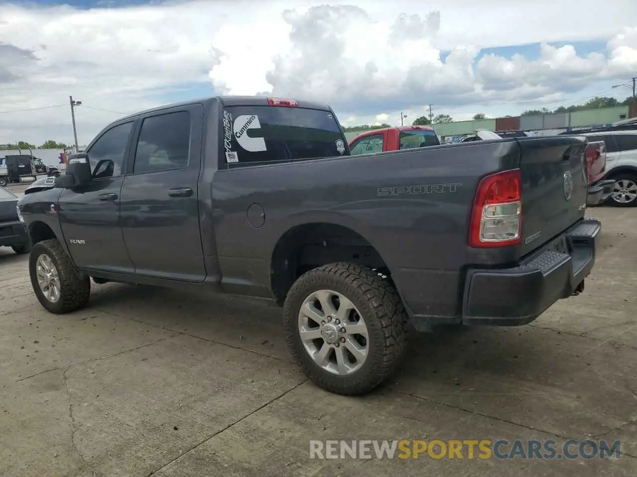 2 Photograph of a damaged car 3C6UR5DL7PG517320 RAM 2500 2023